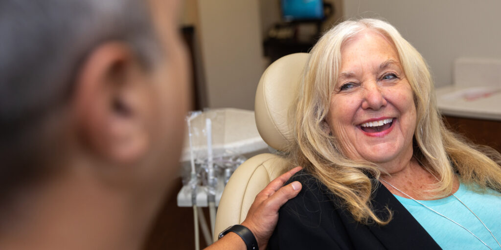 All On X Dental Implant Patient Smiling In A Dental Chair