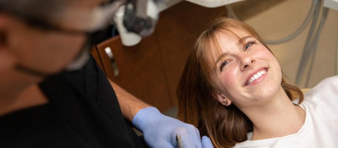 dr clark working with a smiling patient