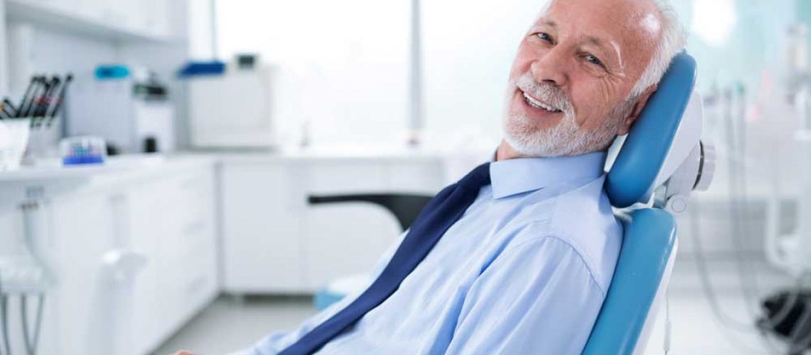 a patient smiling after his sedation dentistry